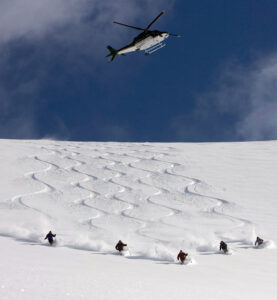Northern Escpae Heli Chopper Over Group Heli Skier