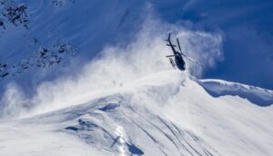 Skeena Heliskiing Helicopter Dive Over Cornice Heli Skier